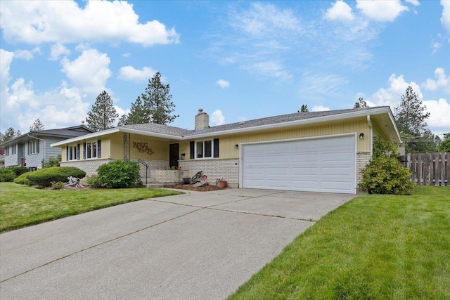 2515 E 38th Ave, Spokane, WA 99223 - ranch-style house with brick siding, a garage, concrete driveway, and a chimney