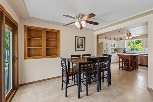 2515 E 38th Ave, Spokane, WA 99223 - dining space featuring a ceiling fan and baseboards