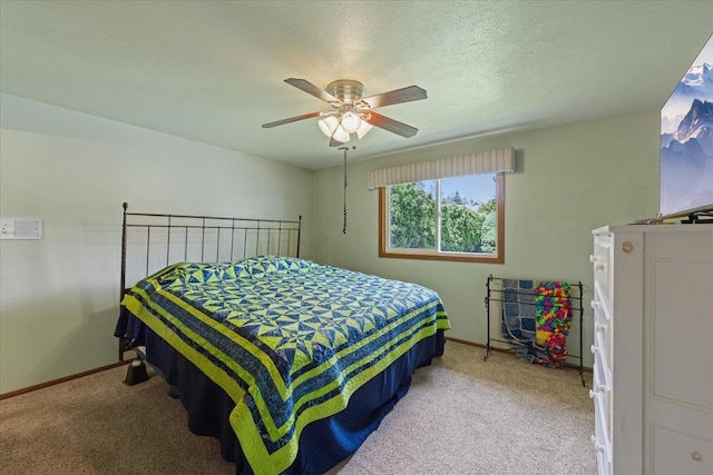 2515 E 38th Ave, Spokane, WA 99223 - bedroom featuring light carpet, ceiling fan, and a textured ceiling