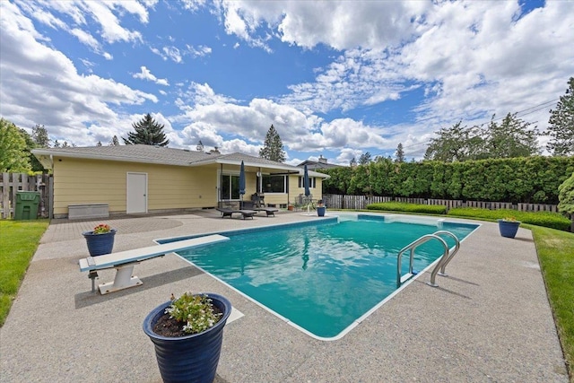 2515 E 38th Ave, Spokane, WA 99223 - view of swimming pool featuring a patio area, a fenced backyard, and a diving board