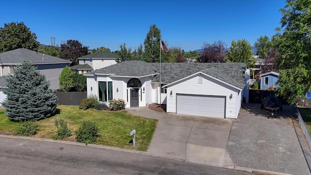 4318 N Upland Ct, Spokane Valley, WA 99216 - traditional-style house with driveway, an attached garage, and a shingled roof