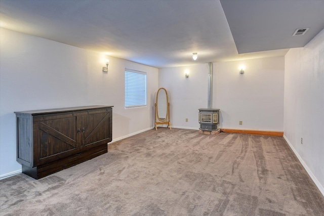 4318 N Upland Ct, Spokane Valley, WA 99216 - basement with a wood stove and carpet floors