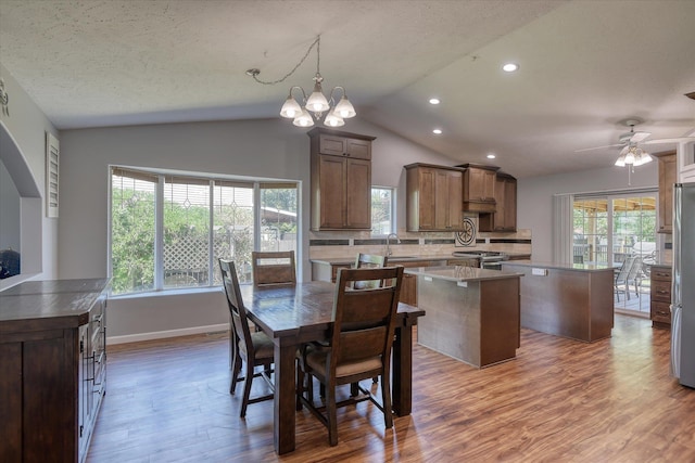 4318 N Upland Ct, Spokane Valley, WA 99216 - dining space with vaulted ceiling, wood finished floors, healthy amount of natural light, recessed lighting, and a ceiling fan