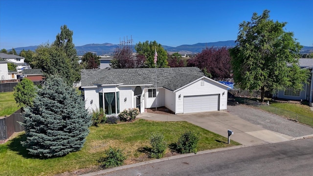 4318 N Upland Ct, Spokane Valley, WA 99216 - ranch-style home with a mountain view, driveway, and a garage