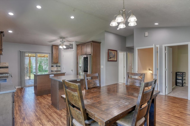 4318 N Upland Ct, Spokane Valley, WA 99216 - dining space with light wood-style floors, lofted ceiling, a chandelier, a ceiling fan, and recessed lighting