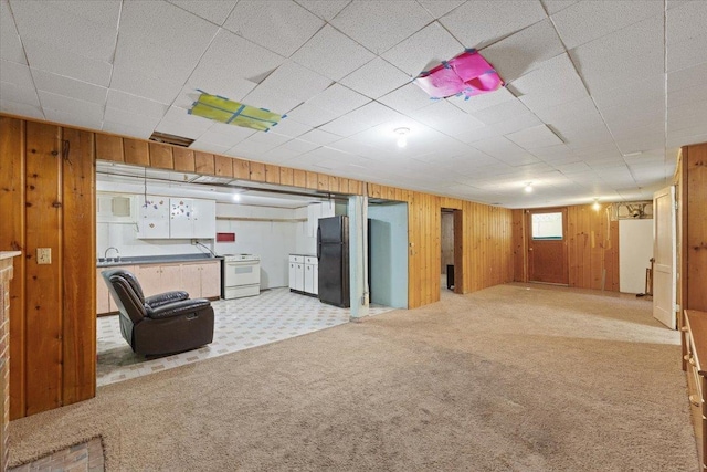 34 E Euclid Ave, Spokane, WA 99207 - unfurnished living room with light carpet and wooden walls