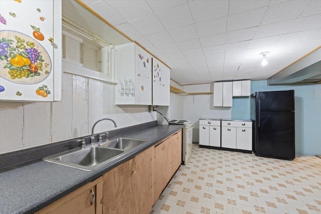 34 E Euclid Ave, Spokane, WA 99207 - kitchen with freestanding refrigerator, white electric range, dark countertops, and light floors