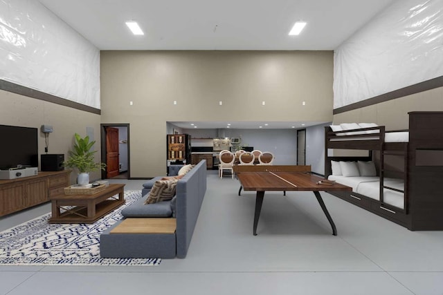201 Dilling Ln, Cusick, WA 99119 - rec room featuring a high ceiling and concrete flooring