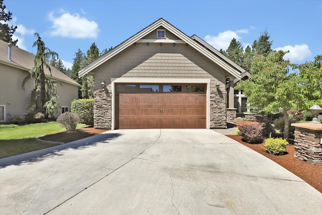 11425 N Lloyd Charles Ln, Spokane, WA 99218 - craftsman-style home with stone siding, concrete driveway, and an attached garage