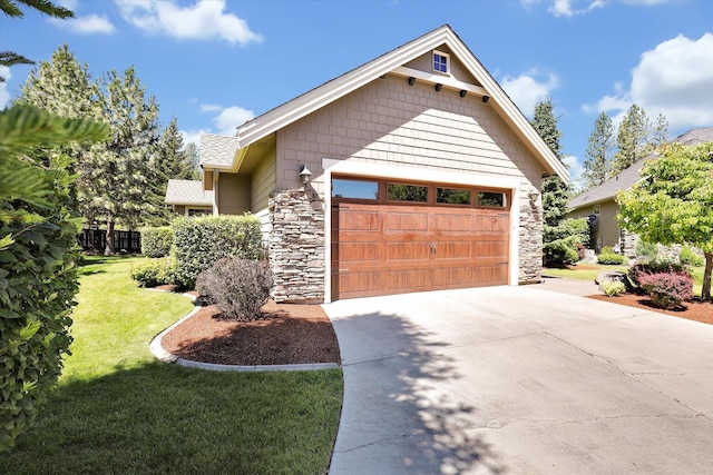 11425 N Lloyd Charles Ln, Spokane, WA 99218 - craftsman inspired home featuring stone siding, a garage, driveway, and a front yard