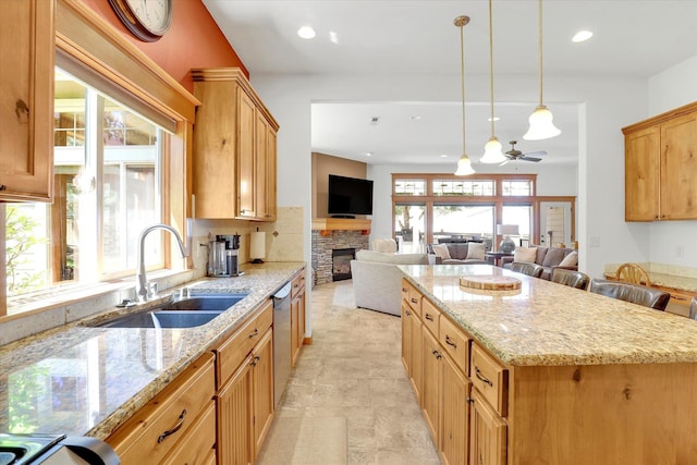 11425 N Lloyd Charles Ln, Spokane, WA 99218 - kitchen with dishwasher, light stone countertops, open floor plan, a kitchen island, and recessed lighting
