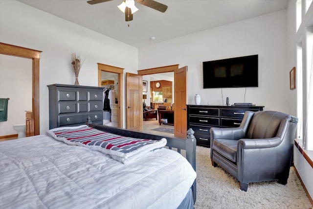 11425 N Lloyd Charles Ln, Spokane, WA 99218 - bedroom with a walk in closet, light colored carpet, connected bathroom, ceiling fan, and a closet