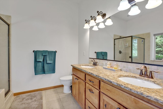 11425 N Lloyd Charles Ln, Spokane, WA 99218 - full bath with a stall shower, double vanity, tile patterned floors, and a chandelier