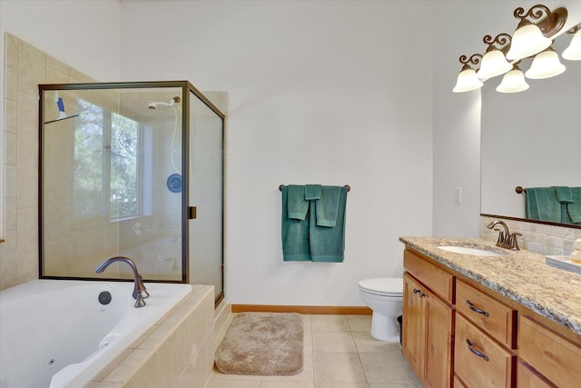 11425 N Lloyd Charles Ln, Spokane, WA 99218 - bathroom with a tub with jets, vanity, a stall shower, and tile patterned flooring