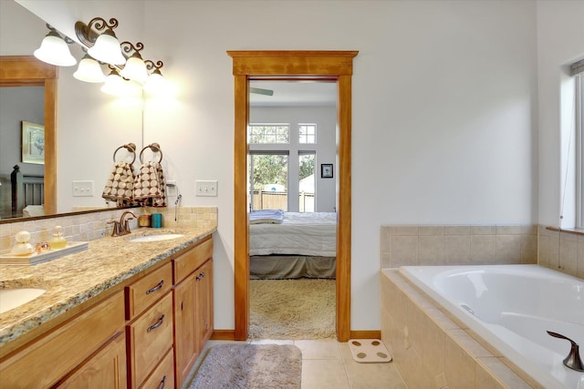 11425 N Lloyd Charles Ln, Spokane, WA 99218 - full bath with double vanity, a garden tub, ensuite bath, a chandelier, and tile patterned flooring