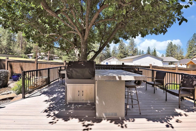 11425 N Lloyd Charles Ln, Spokane, WA 99218 - wooden deck featuring grilling area and a fenced backyard