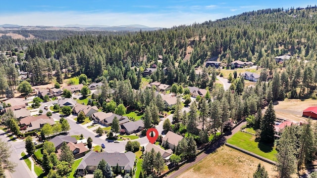 11425 N Lloyd Charles Ln, Spokane, WA 99218 - aerial perspective of suburban area featuring a heavily wooded area and mountains