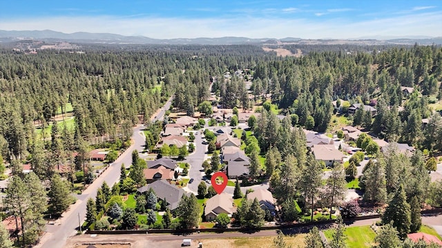 11425 N Lloyd Charles Ln, Spokane, WA 99218 - aerial perspective of suburban area with a forest and a mountainous background