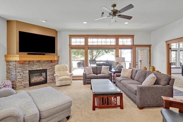 11425 N Lloyd Charles Ln, Spokane, WA 99218 - carpeted living area featuring a fireplace, recessed lighting, and ceiling fan