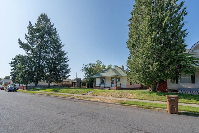 1019 E Everett Ave, Spokane, WA 99207 - view of property hidden behind natural elements with a front lawn