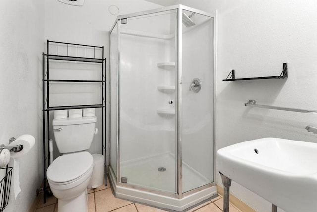 1019 E Everett Ave, Spokane, WA 99207 - full bathroom with a shower stall and tile patterned flooring