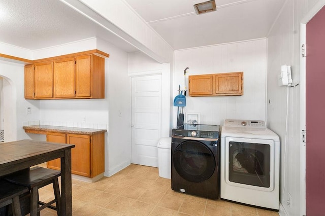 1019 E Everett Ave, Spokane, WA 99207 - laundry room with cabinet space, independent washer and dryer, and arched walkways