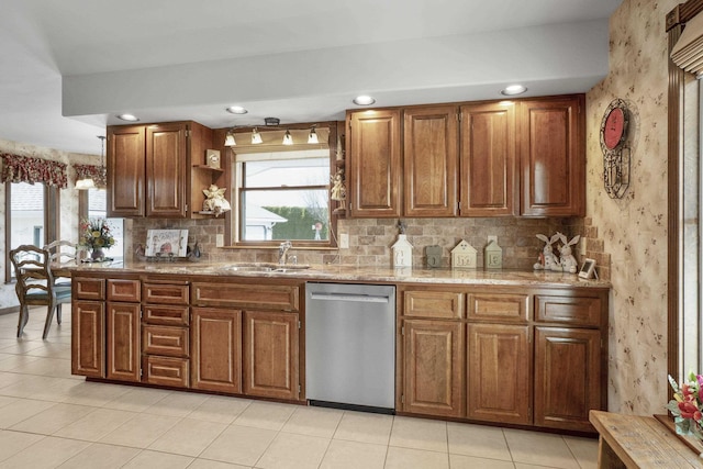 3333 N Ashton Rd, Otis Orchards, WA 99027 - kitchen with stainless steel dishwasher, wallpapered walls, brown cabinets, decorative backsplash, and recessed lighting