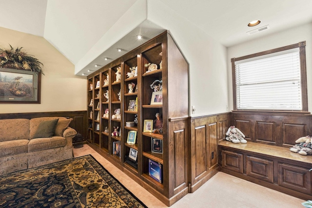 3333 N Ashton Rd, Otis Orchards, WA 99027 - living area with a wainscoted wall, vaulted ceiling, and wood walls