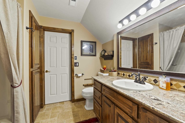 3333 N Ashton Rd, Otis Orchards, WA 99027 - full bathroom featuring vanity, stone tile floors, lofted ceiling, and curtained shower