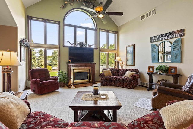 3333 N Ashton Rd, Otis Orchards, WA 99027 - carpeted living room with high vaulted ceiling, ceiling fan, and a glass covered fireplace