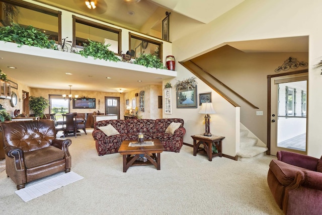 3333 N Ashton Rd, Otis Orchards, WA 99027 - living room with carpet floors, stairway, a chandelier, and a high ceiling