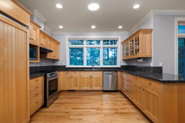 1807 E Pinegate Ln, Spokane, WA 99224 - kitchen featuring stainless steel appliances, light brown cabinetry, ornamental molding, light wood-style flooring, and glass insert cabinets