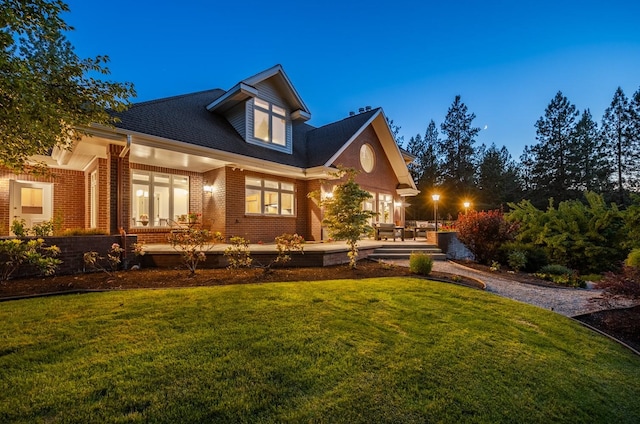 1807 E Pinegate Ln, Spokane, WA 99224 - view of front facade with a front lawn, brick siding, and a shingled roof