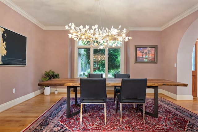 1807 E Pinegate Ln, Spokane, WA 99224 - dining area featuring arched walkways, wood finished floors, ornamental molding, and a chandelier