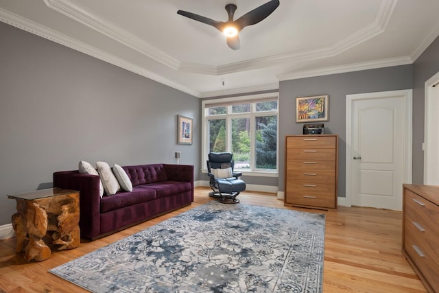 1807 E Pinegate Ln, Spokane, WA 99224 - living room featuring light wood-style flooring, crown molding, a ceiling fan, and a raised ceiling