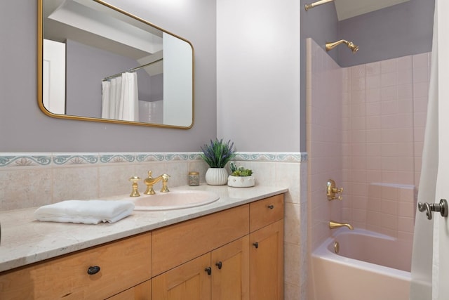 1807 E Pinegate Ln, Spokane, WA 99224 - bathroom featuring vanity, shower / bath combination with curtain, tile walls, and wainscoting