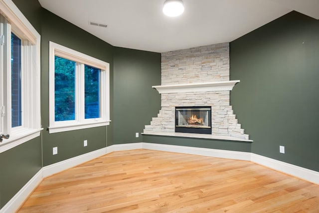 1807 E Pinegate Ln, Spokane, WA 99224 - unfurnished living room featuring wood finished floors and a fireplace