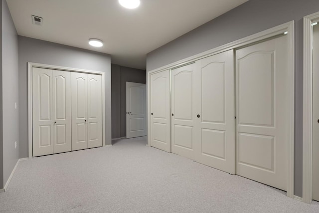 1807 E Pinegate Ln, Spokane, WA 99224 - unfurnished bedroom featuring carpet flooring and two closets