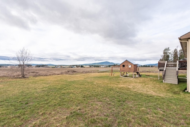 8715 W Antler Rd, Deer Park, WA 99006 - view of grassy yard with a deck and stairs