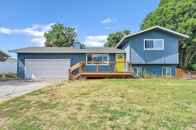 15217 E 15th Ave, Spokane Valley, WA 99037 - tri-level home with a wooden deck, driveway, and an attached garage