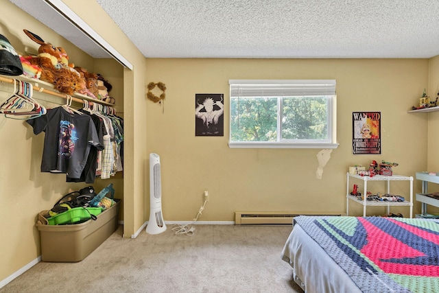 15217 E 15th Ave, Spokane Valley, WA 99037 - bedroom with a baseboard heating unit, carpet flooring, a closet, and a textured ceiling
