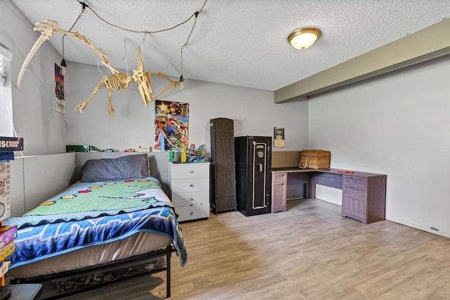 15217 E 15th Ave, Spokane Valley, WA 99037 - bedroom featuring light wood-style flooring and a textured ceiling