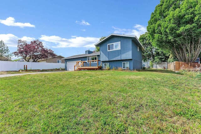 15217 E 15th Ave, Spokane Valley, WA 99037 - rear view of house with an attached garage and a deck