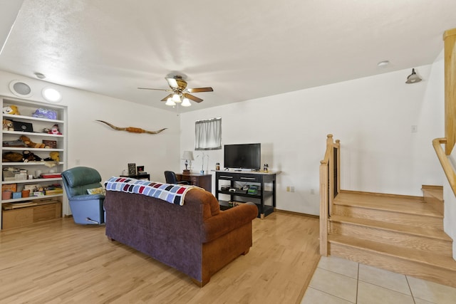 20902 S Ritchey Rd, Spokane, WA 99004 - living area with a ceiling fan, light wood-type flooring, and stairs