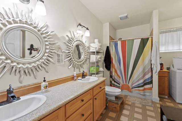 20902 S Ritchey Rd, Spokane, WA 99004 - full bath with tile patterned floors, double vanity, a shower with shower curtain, and washer / dryer