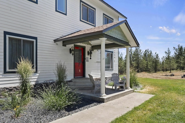 20902 S Ritchey Rd, Spokane, WA 99004 - property entrance with a yard and roof with shingles