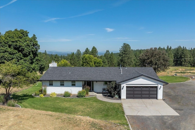 9307 E Morgan Rd, Spokane, WA 99217 - single story home featuring a garage, a front yard, driveway, and a chimney