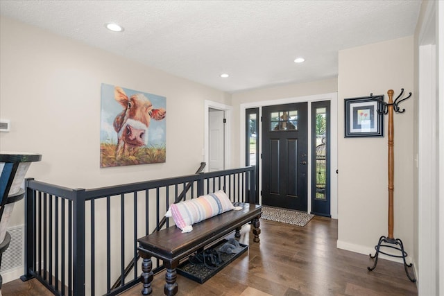 9307 E Morgan Rd, Spokane, WA 99217 - foyer featuring wood finished floors, recessed lighting, and a textured ceiling