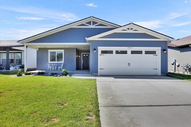10521 W Salmonberry Rd, Cheney, WA 99004 - view of front facade featuring an attached garage, a front yard, concrete driveway, and a porch