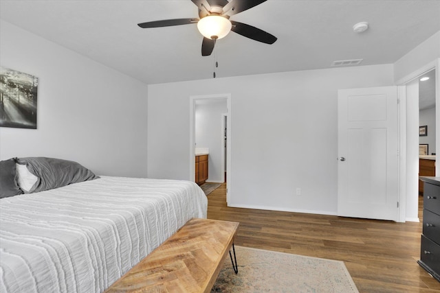 10521 W Salmonberry Rd, Cheney, WA 99004 - bedroom featuring wood finished floors, connected bathroom, and ceiling fan
